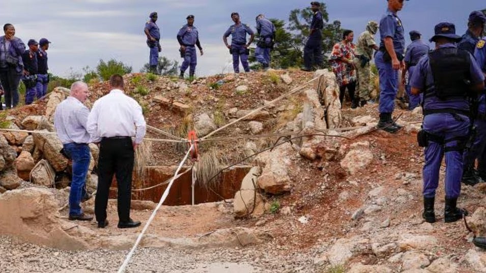 | Photo- AP : The mine has been the scene of a standoff between police and miners since authorities first attempted to force the miners out and seal the mine two months ago.
