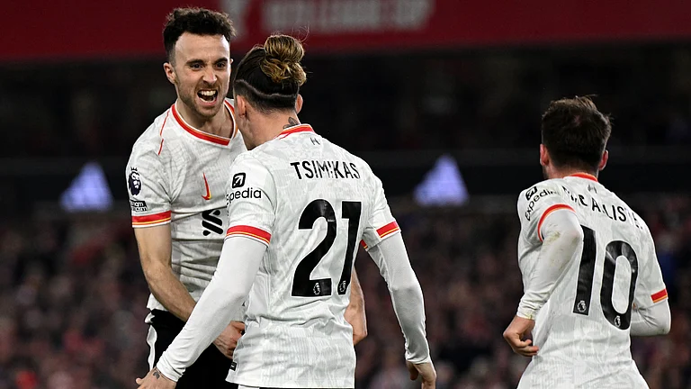 Diogo Jota celebrates his equaliser at the City Ground - null
