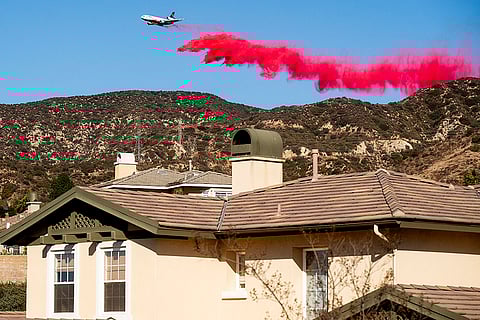 An air tanker drops retardant in Altadena