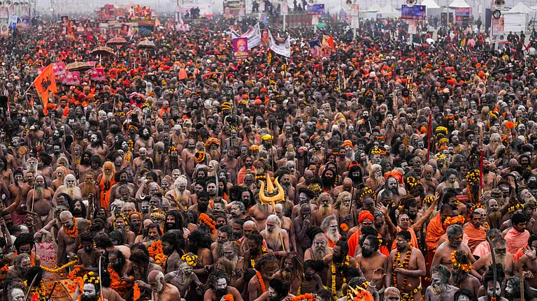 Naga Sadhus of Shri Panchayati Niranjani Akhada arrive to take a holy dip during the first 'Amrit Snan' at the Mahakumbh on the Makar Sankranti festival, at Sangam in Prayagraj, Tuesday, Jan. 14, 2025.  - PTI