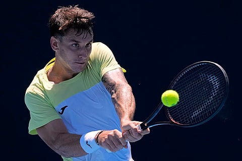 Australian Open 2025: Camilo Ugo Carabelli plays a backhand return to Learner Tien