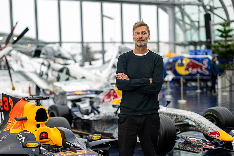 Jurgen Klopp Poses With Red Bull F1 cars in Salzburg