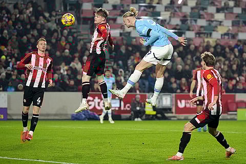 EPL 2024-25: Manchester City's Erling Haaland heads the ball 