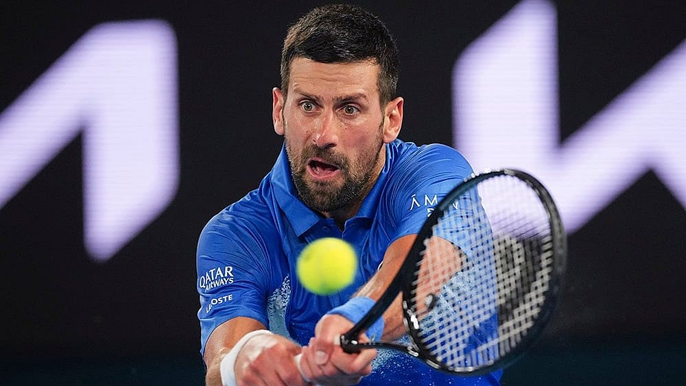 | Photo: AP/Vincent Thian : Australian Open 2025: Novak Djokovic plays a backhand return to Alexander Zverev 