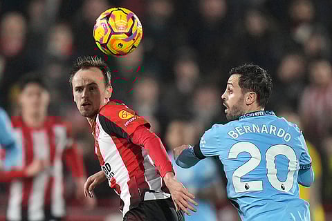 EPL 2024-25: Manchester City's Bernardo Silva and Brentford's Sepp van den Berg vie for the ball