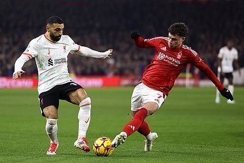 EPL 2024-25: Liverpool's Mohamed Salah duels for the ball with Nottingham Forest's Neco Williams