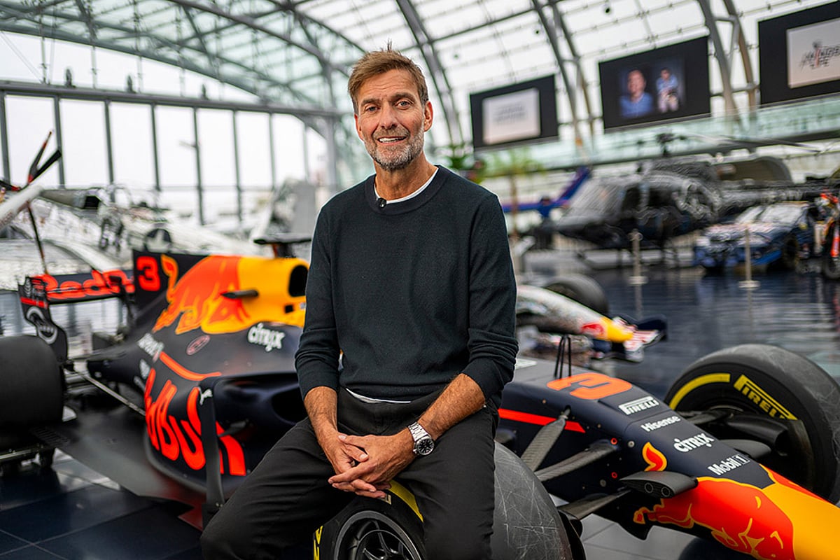 Jurgen Klopp Poses With Red Bull F1 cars in Salzburg