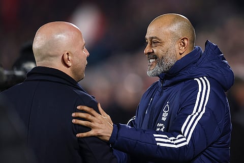 EPL 2024-25: Liverpool's manager Arne Slot speaks with Nottingham Forest's head coach Nuno Espirito Santo