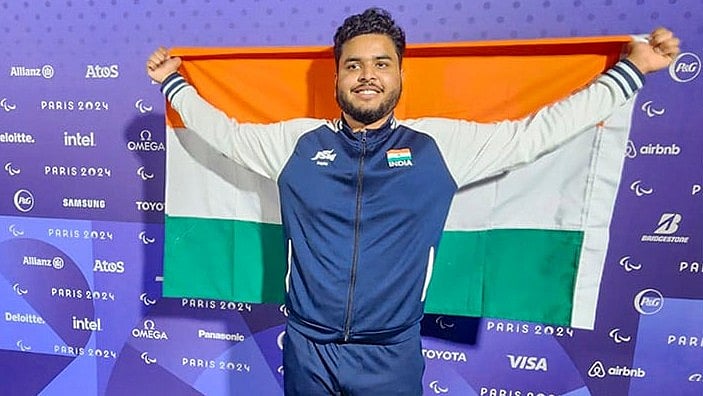| Photo: PTI : 2024 Paris Paralympics: Yogesh Kathuniya, discus thrower, poses for photos after winning the silver medal in F56 category 
