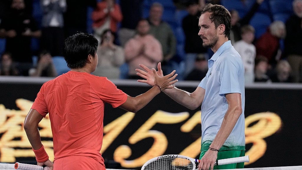 Photo: AP : Daniil Medvedev (right) lost to 19-year-old Learner Tien in the Australian Open second round.