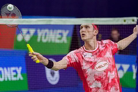 BWF India Open 2025: Denmark's Viktor Axelsen returns a shot against Taiwan’s Chi Yu-jen