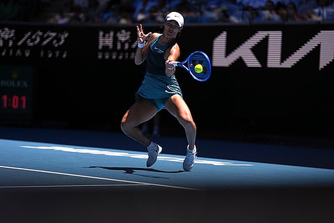 Australian Open 2025: Wang Xiyu plays a forehand return to Emma Navarro