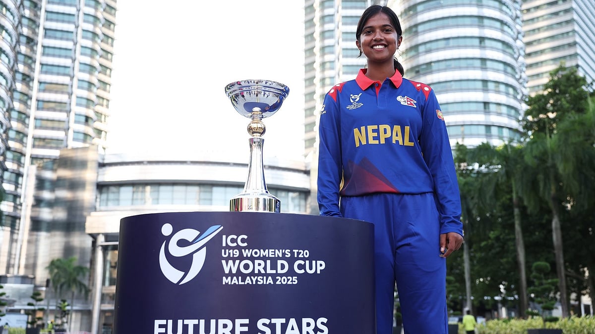 ICC : Nepal captain Puja Mahato poses with the Women's Under-19 T20 World Cup trophy in Malaysia.