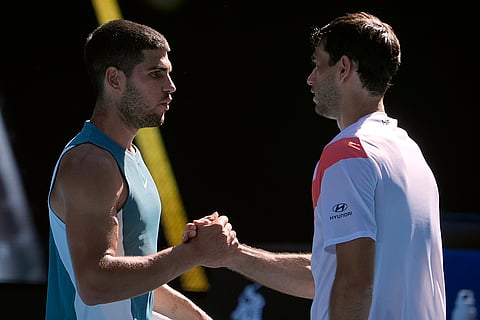 Australian Open 2025: Carlos Alcaraz, left, is congratulated by Nuno Borges