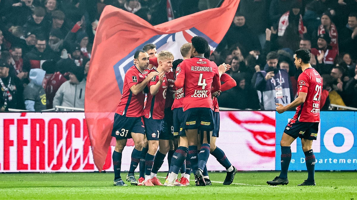Lille players celebrate a goal.