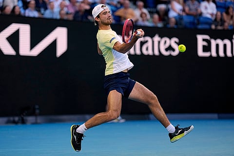 Australian Open 2025: Tomas Machac plays a forehand return to Novak Djokovic