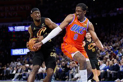 NBA 2024-25: Cavaliers guard Caris LeVert drives against Thunder forward Jalen Williams