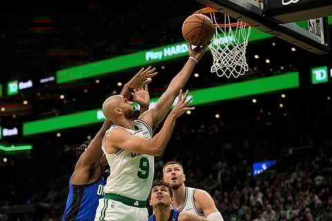 NBA 2024-25: Boston Celtics' Derrick White (9) goes up for a lay-up
