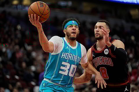 NBA 2024-25: Bulls guard Zach LaVine (8) guards against Hornets guard Seth Curry