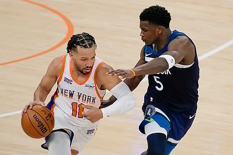 NBA 2024-25: Timberwolves' Anthony Edwards (5) defends Knicks' Jalen Brunson