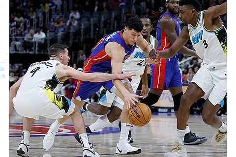 NBA 2024-25: Pistons forward Simone Fontecchio, center, tries to drive the lane against Pacers