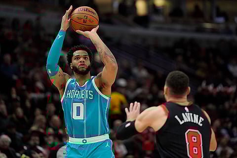 NBA 2024-25: Hornets forward Miles Bridges (0) shoots over Bulls guard Zach LaVine