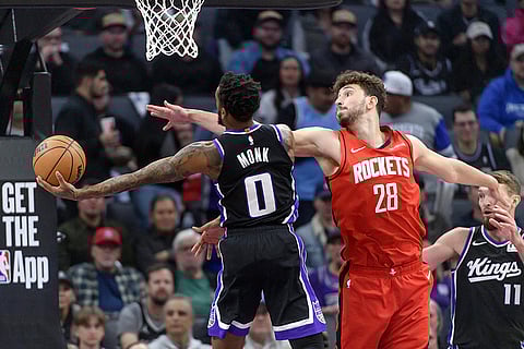 NBA 2024-25: Kings guard Malik Monk (0) is guarded by Rockets center Alperen Sengun