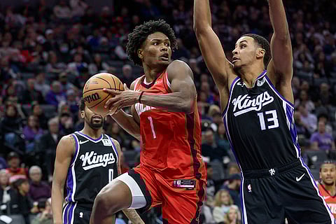 NBA 2024-25: Rockets forward Amen Thompson (1) is guarded by Kings forward Keegan Murray
