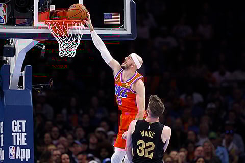 NBA 2024-25: Thunder guard Alex Caruso (9) dunks against Cavaliers