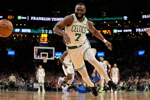 NBA 2024-25: Celtics' Jaylen Brown (7) chases a loose ball