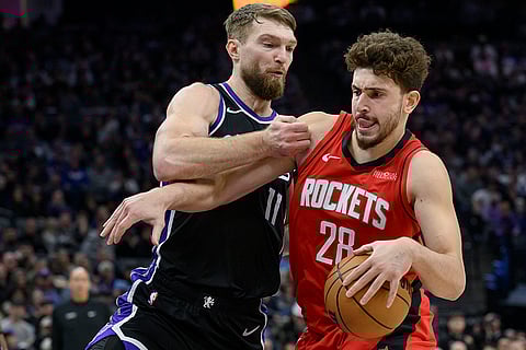 NBA 2024-25: Rockets center Alperen Sengun (28) is guarded by Kings forward Domantas Sabonis