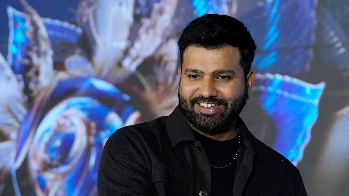 Indian cricketer Rohit Sharma smiles during a promotional event in Mumbai. - AP Photo/Rajanish Kakade