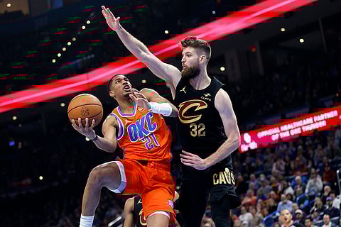 NBA 2024-25: Thunder guard Aaron Wiggins (21) goes to the basket against Cavaliers forward Dean Wade