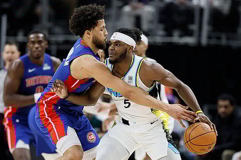 NBA 2024-25: Pistons guard Cade Cunningham tries to take the ball away from Pacers forward