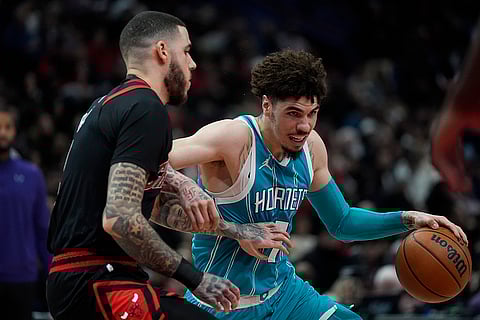 NBA 2024-25: Bulls guard Lonzo Ball guards against Hornets guard LaMelo Ball