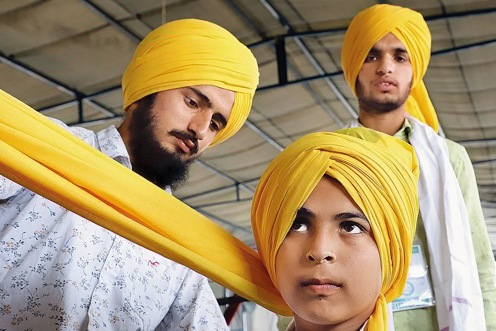 | Photo: Suresh K. Pandey : Marching On: Farmers, wearing yellow turbans, getting ready for a protest march