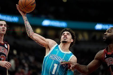 NBA 2024-25: Hornets guard LaMelo Ball (1) makes a shot