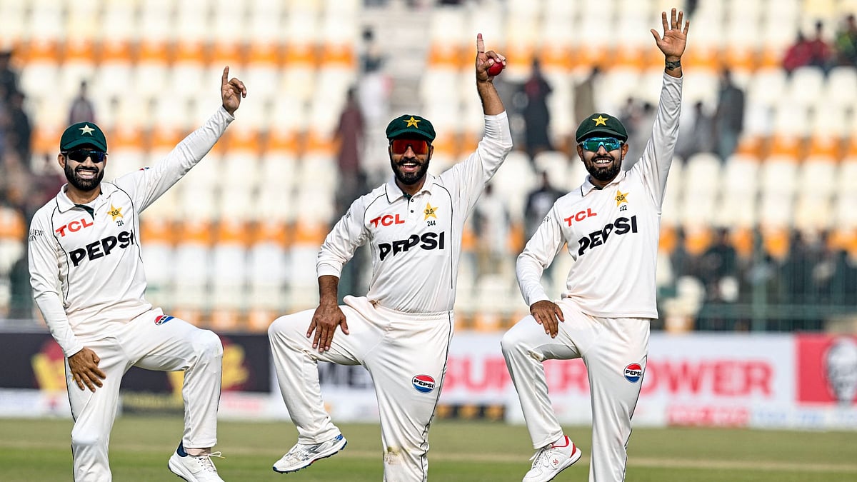 Sajid (centre) celebrates with Rizwan (left) and Azam