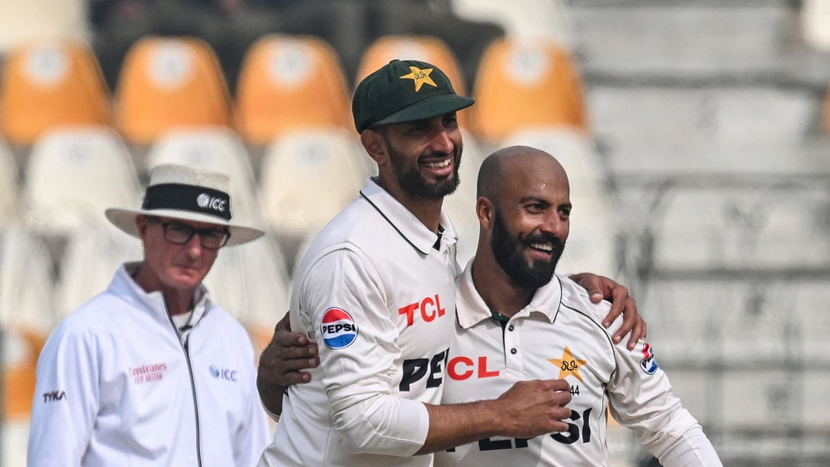 Sajid Khan and Shan Masood celebrate Pakistan's win against West Indies.