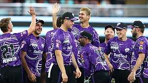 X/HurricanesBBL : The Hobart Hurricanes during a match at the BBL 2024-25 tournament.