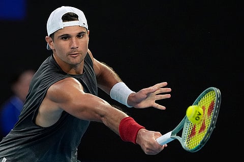 Australian Open 2025: Marcos Giron plays a backhand return to Jannik Sinner