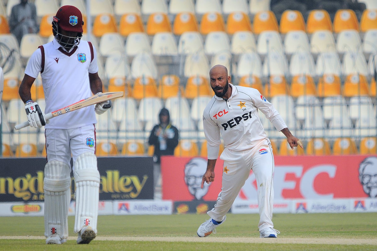 (AP Photo/Asim Tanveer) : Pakistan's Sajid Khan, right, celebrates after taking the wicket of West Indies Kraigg Brathwaite, left, during the day three of the first test cricket match between Pakistan and West Indies, in Multan, Pakistan, Sunday, Jan. 19, 2025. 