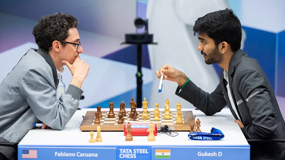 X/tatasteelchess : D Gukesh playing against Fabiano Caruana at the Tata Steel Chess tournament.