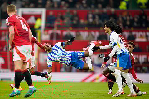 EPL 2024-25: Brighton's Pervis Estupinan, center, is fouled by Man United's Manuel Ugarte