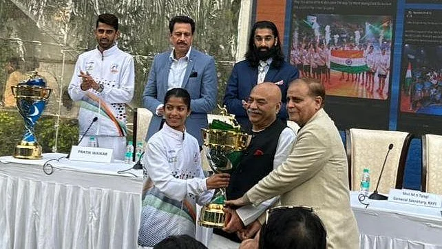 Indian womens team captain Priyanka Ingle hands over the Kho Kho World Cup trophy