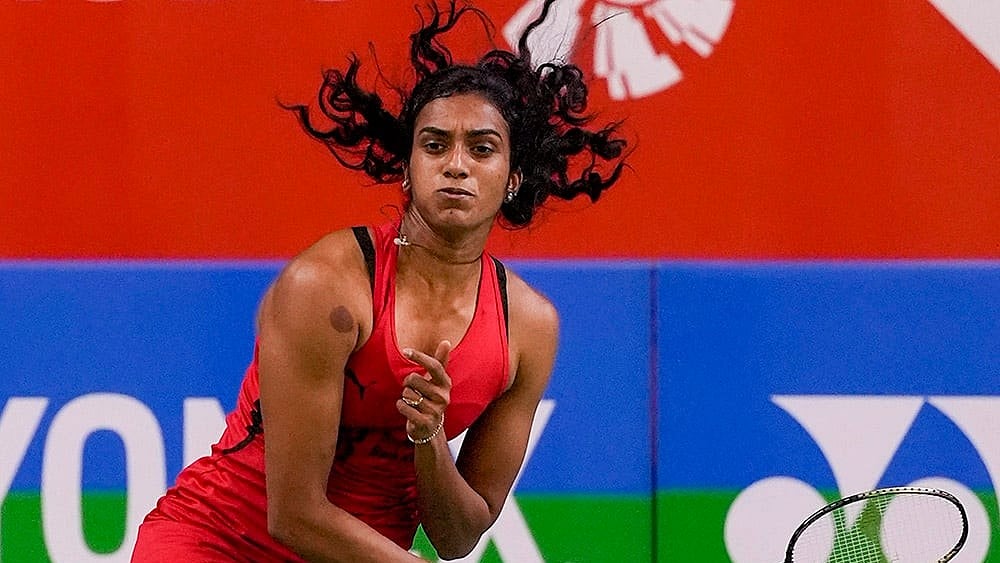 | Photo: PTI/Gurinder Osan : India's PV Sindhu returns a shot during women's singles quarterfinal match