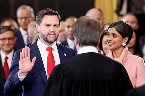US Vice President-elect JD Vance, left, takes oath