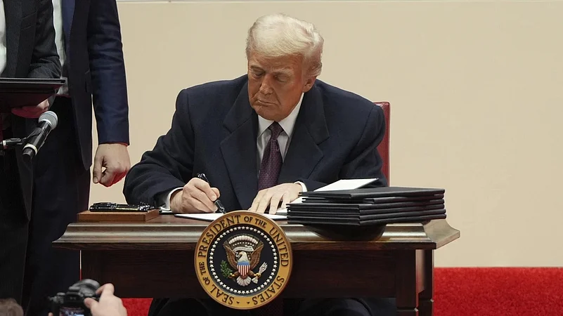 US President Donald Trump signing executive orders at the White House on Monday