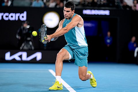 Australian Open 2025: Carlos Alcaraz plays a backhand return to Novak Djokovic