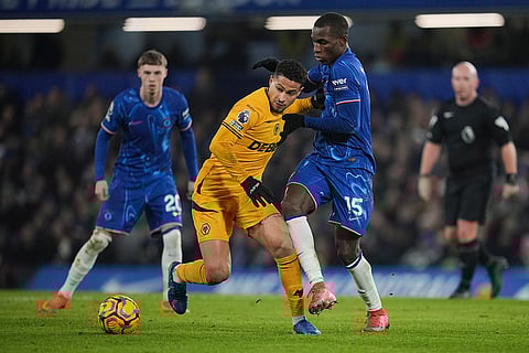 EPL 2024-25: Wolves Joao Gomes duels for the ball with Chelsea's Nicolas Jackson